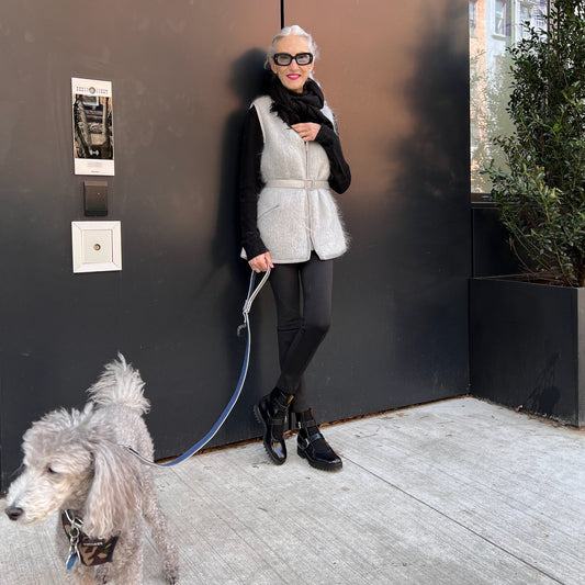 @lindaandwinks IG influencer Linda Rodin and silver poodlle in Vespertine NYC mohair sweater reflective vest dog walker walking chic bike cyclist ebike safety vest