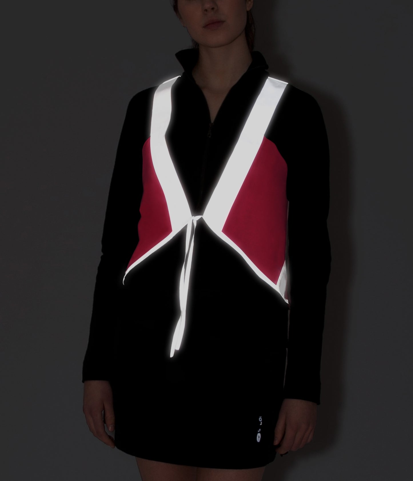 model wears cute vespert eco cotton candy neon pink stylish reflective hi vis safety vest for women reflecting clothing high visibility gear accessory womens fashion bike bike cycling walk run running dog walking walker night sustainable nighttime bright 3M scotchlite made in NYC USA