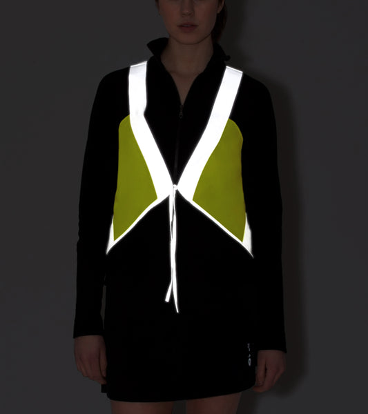 model wears vespert eco citron neon yellow stylish reflective vis safety vest reflecting clothing high visibility gear accessory women fashion bike walk run dog walking walker night sustainable nighttime bright 3M scotchlite made in NYC USA