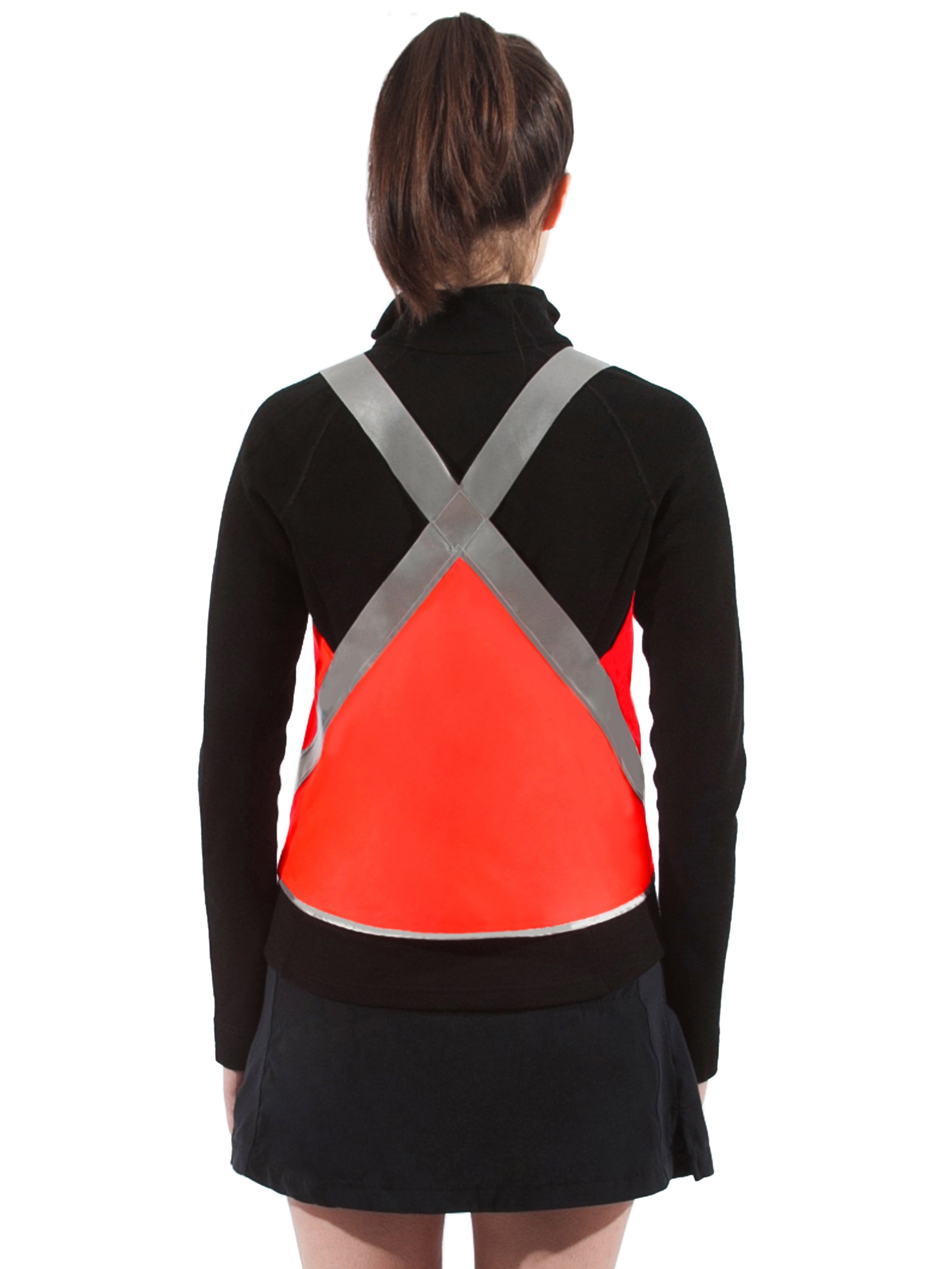 model seen from behind wearing cute vespert eco flame neon orange stylish reflective hi vis safety vest for women reflecting clothing high visibility gear accessory womens fashion bike ebike cycling walk run running dog walking walker night sustainable nighttime bright made of eco-circle recycled polyester and 360 3M scotchlite material in NYC USA designed to be seen day and night packable