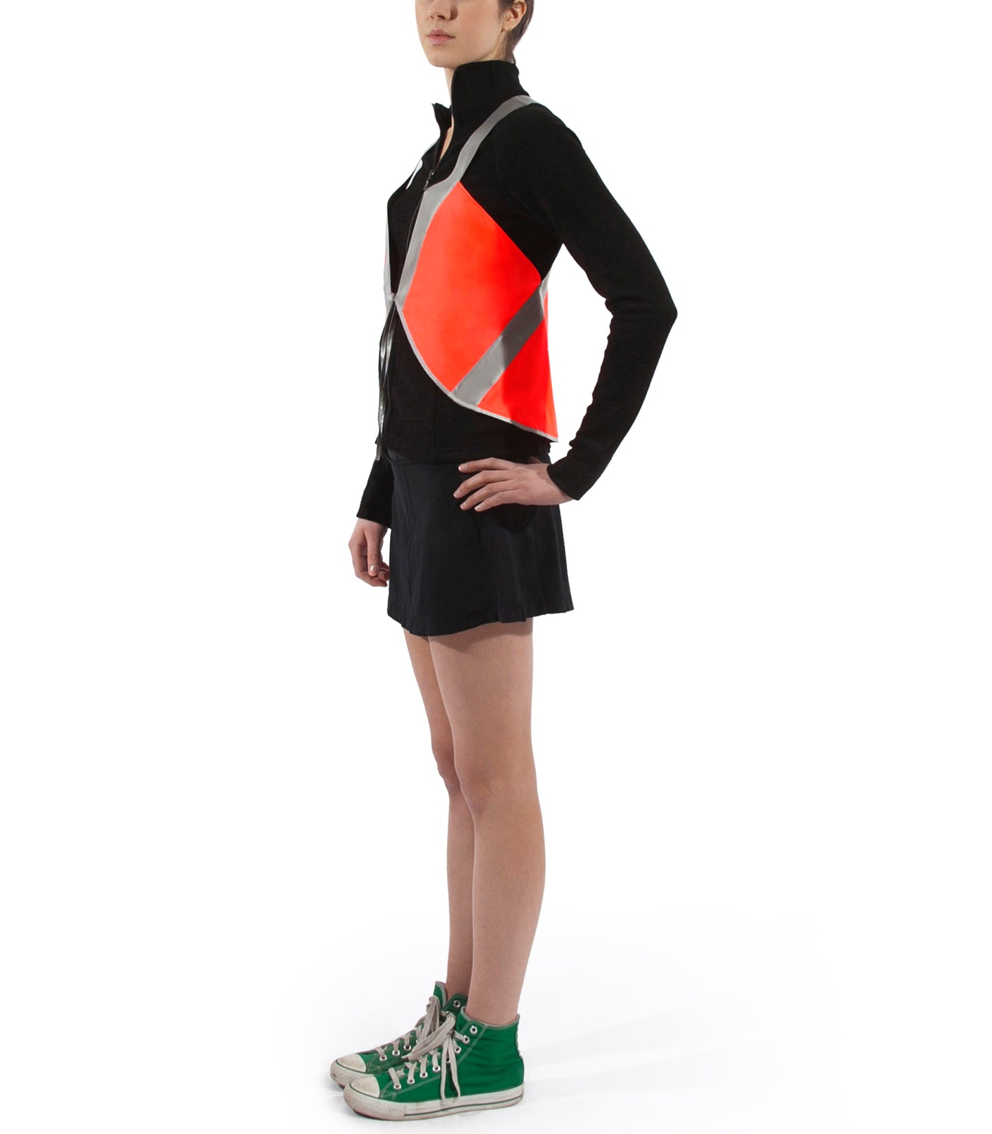 model wears cute vespert eco flame neon orange stylish reflective hi vis safety vest for women reflecting clothing high visibility gear accessory womens fashion bike ebike cycling walk run running dog walking walker night sustainable nighttime bright made of eco-circle recycled polyester and 360 3M scotchlite material in NYC USA designed to be seen day and night packable